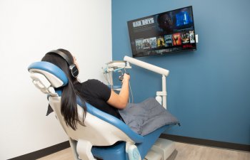 Woman watching TV in dental chair